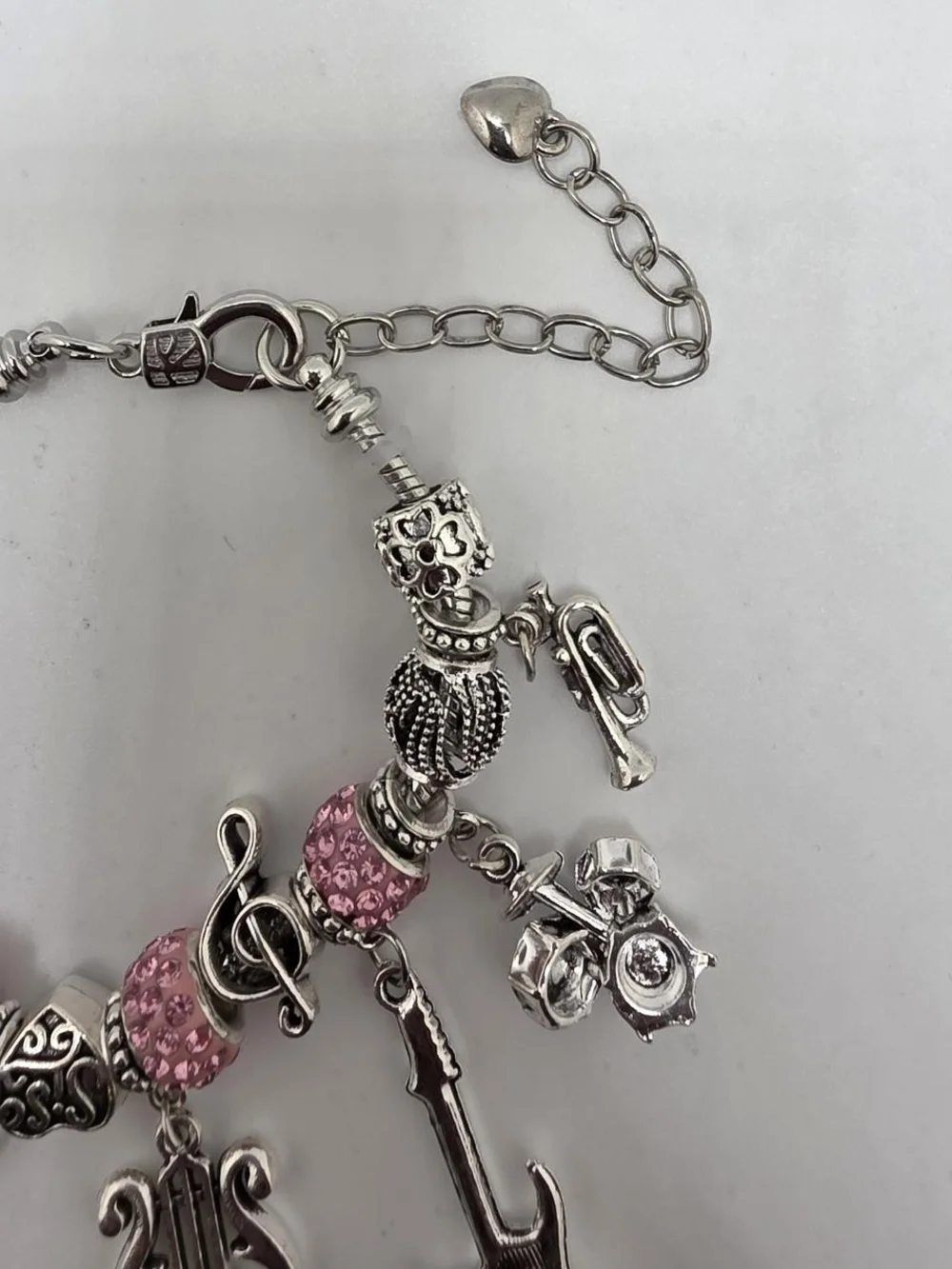 Silver Music Charm Bracelet with Pink Accents